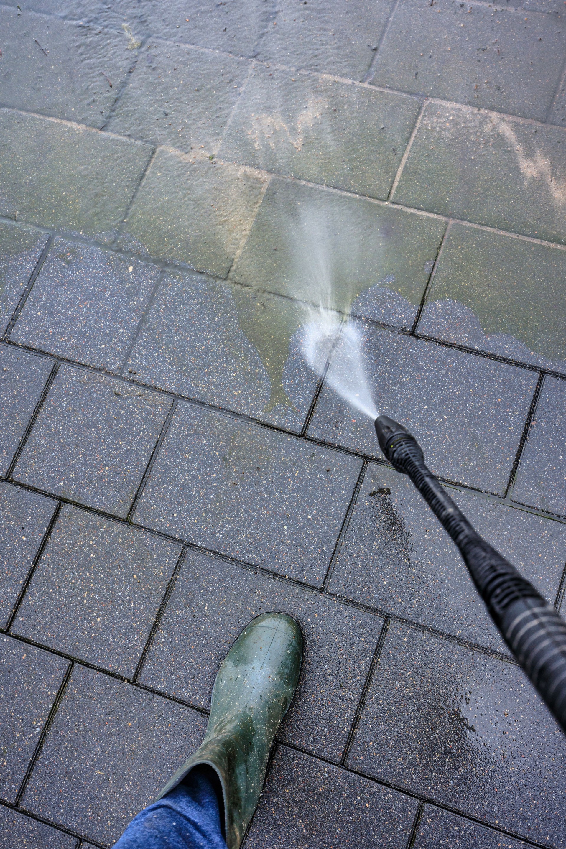 Spring cleaning of the pavement in the driveway of the house.